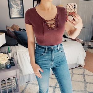 Maroon bodysuit with lace up front.